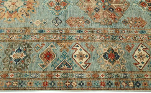 Corner detail of New Kazak rug showing border pattern and Wool pile