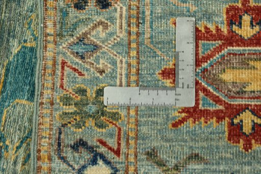 Backside of handmade New Kazak rug showing knot structure and weave density
