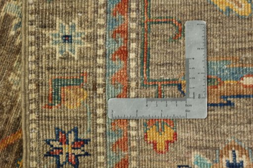 Backside of handmade New Kazak rug showing knot structure and weave density