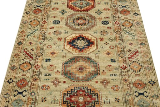 Backside of handmade New Kazak rug showing knot structure and weave density