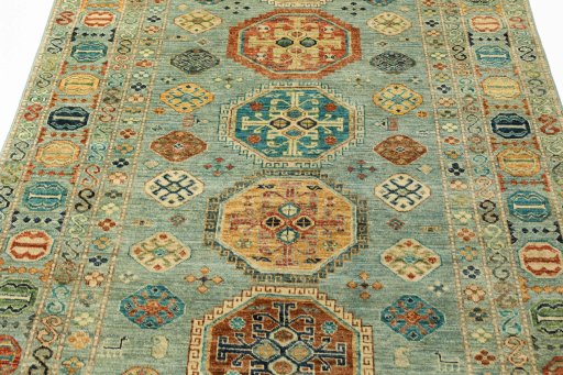 Backside of handmade New Kazak rug showing knot structure and weave density