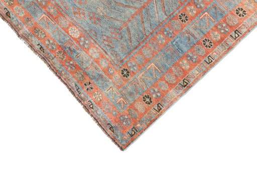 Backside of handmade 1920s Oushak rug showing knot structure and weave density