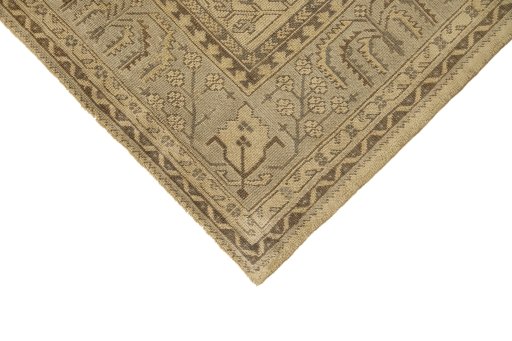 Backside of handmade 1920s Oushak rug showing knot structure and weave density