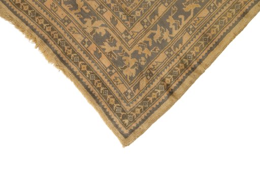 Backside of handmade 1920s Oushak rug showing knot structure and weave density