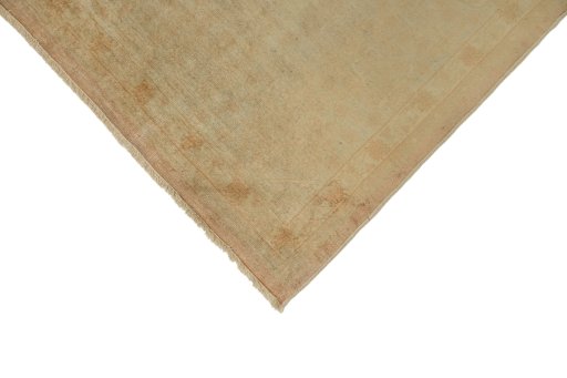 Backside of handmade 1920s Oushak rug showing knot structure and weave density