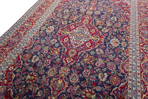 Backside of handmade 2000s Kashan rug showing knot structure and weave density