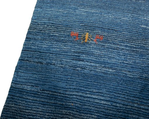 Backside of handmade New Persian Gabbeh rug showing knot structure and weave density
