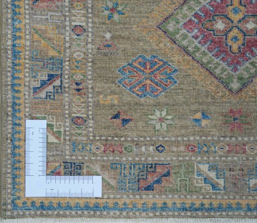 Corner detail of New Kazak rug showing border pattern and Wool pile