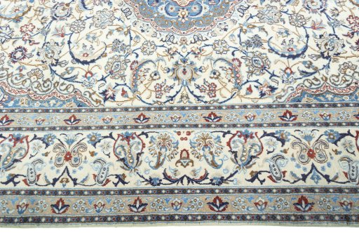 Corner detail of 2000s Nain rug showing border pattern and Wool pile