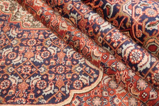 Corner detail of 2000s Bijar rug showing border pattern and Wool pile