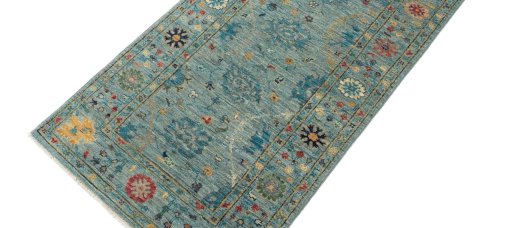 Backside of handmade New Farahan rug showing knot structure and weave density