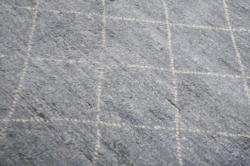 Backside of handmade New Morocco rug showing knot structure and weave density