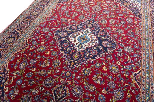 Backside of handmade 2000s Kashan rug showing knot structure and weave density