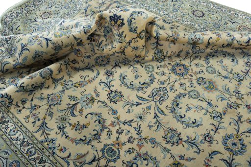 Surface texture of 2000s Kashan rug with natural Cork and intricate pattern