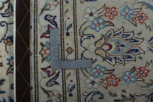 Backside of handmade 2000s Kashan rug showing knot structure and weave density