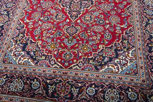 Close-up detail of 2000s Kashan rug from Iran / Persia showing Wool weave
