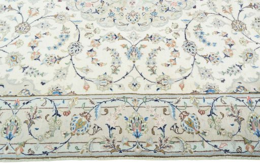 Corner detail of New Kashan rug showing border pattern and Wool pile