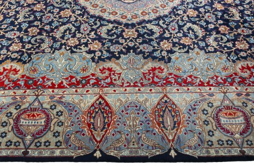 Corner detail of 1970s Kashmar rug showing border pattern and Wool pile