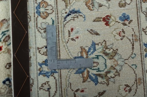 Backside of handmade New Kashan rug showing knot structure and weave density