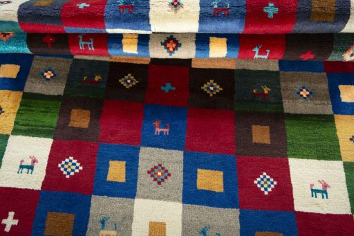 Full view of 2000s Persian Gabbeh rug from Pakistan, 220 × 143 cm in Multi Color tones