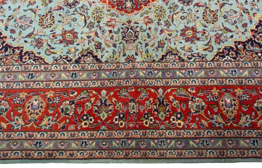 Corner detail of New Kashan rug showing border pattern and Cork pile