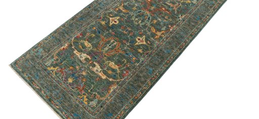 Backside of handmade New Farahan rug showing knot structure and weave density