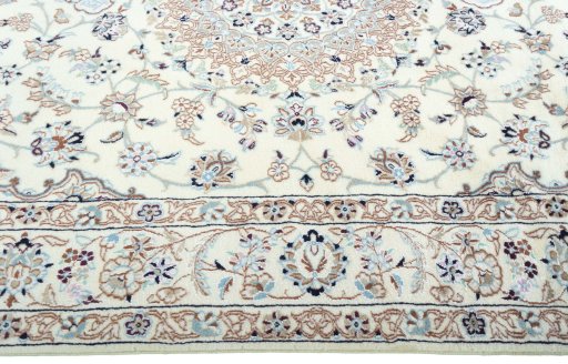 Corner detail of New Nain rug showing border pattern and Wool pile