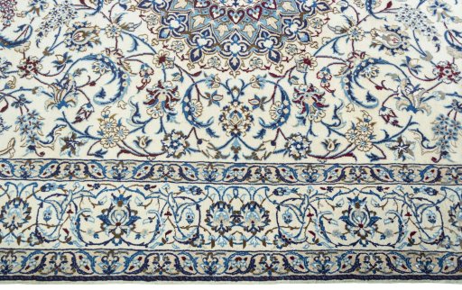 Corner detail of 2000s Nain rug showing border pattern and Wool pile