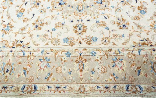 Corner detail of New Kashan rug showing border pattern and Wool pile