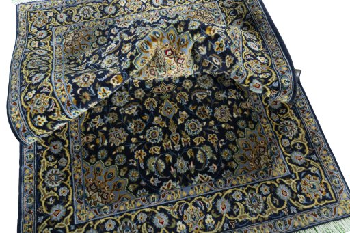 Surface texture of 2000s Kashan rug with natural Wool and intricate pattern