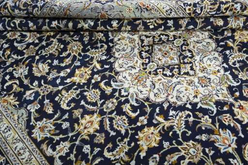 Close-up detail of 2000s Kashan rug from Iran / Persia showing Wool weave