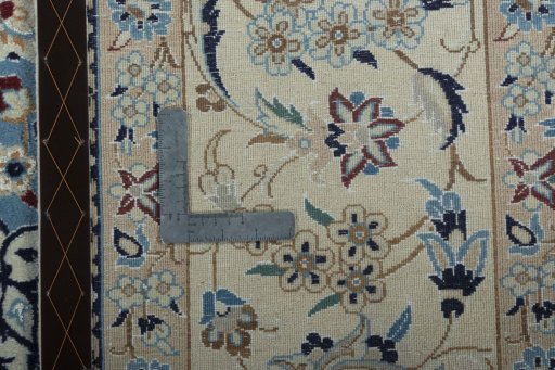 Backside of handmade 2000s Nain rug showing knot structure and weave density