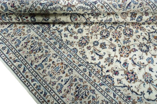 Close-up detail of 2000s Kashan rug from Iran / Persia showing Wool weave