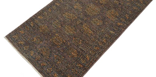 Backside of handmade New Farahan rug showing knot structure and weave density