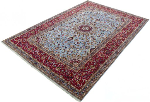 Corner detail of 2000s Kashan rug showing border pattern and Wool pile