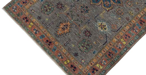 Backside of handmade New Kazak rug showing knot structure and weave density