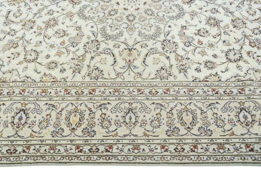 Corner detail of 2000s Kashan rug showing border pattern and Wool pile