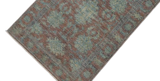 Backside of handmade New Farahan rug showing knot structure and weave density