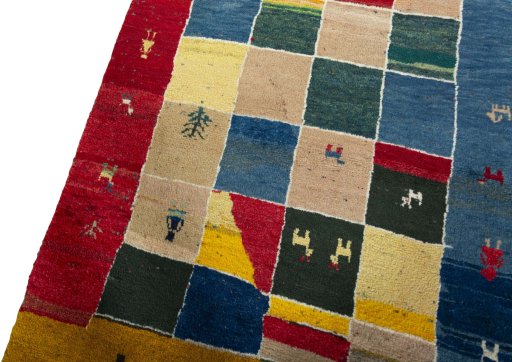 Backside of handmade 2000s Persian Gabbeh rug showing knot structure and weave density