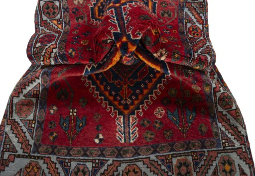 Corner detail of 2000s Shiraz rug showing border pattern and Wool pile