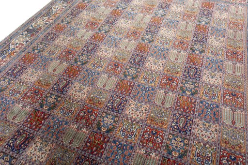 Backside of handmade 2000s Moud rug showing knot structure and weave density