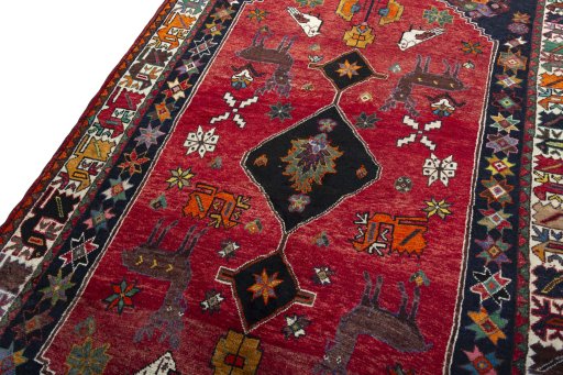 Backside of handmade 2000s Shiraz rug showing knot structure and weave density