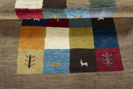 Full view of 2000s Persian Gabbeh rug from Pakistan, 171 × 123 cm in Multi Color tones