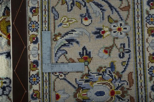 Backside of handmade 2000s Kashan rug showing knot structure and weave density