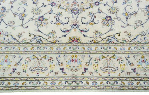 Corner detail of New Kashan rug showing border pattern and Wool pile