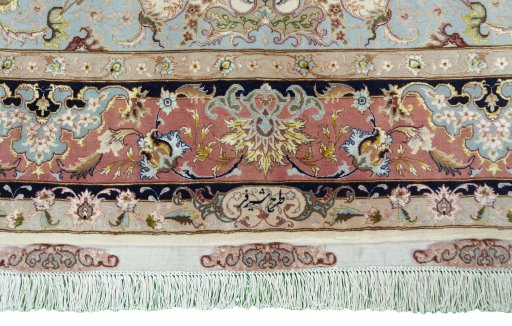 Backside of handmade New Tabriz 50/60/70 Raj rug showing knot structure and weave density