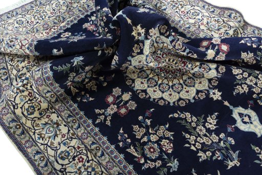 Surface texture of 2000s Nain rug with natural Wool and intricate pattern