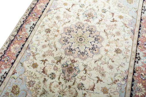Backside of handmade New Tabriz 50/60/70 Raj rug showing knot structure and weave density