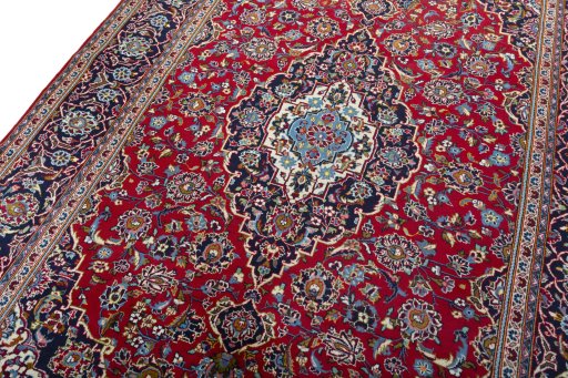 Backside of handmade 2000s Kashan rug showing knot structure and weave density
