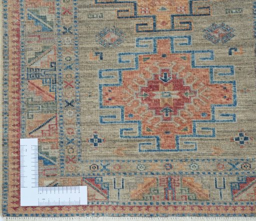 Corner detail of New Kazak rug showing border pattern and Wool pile